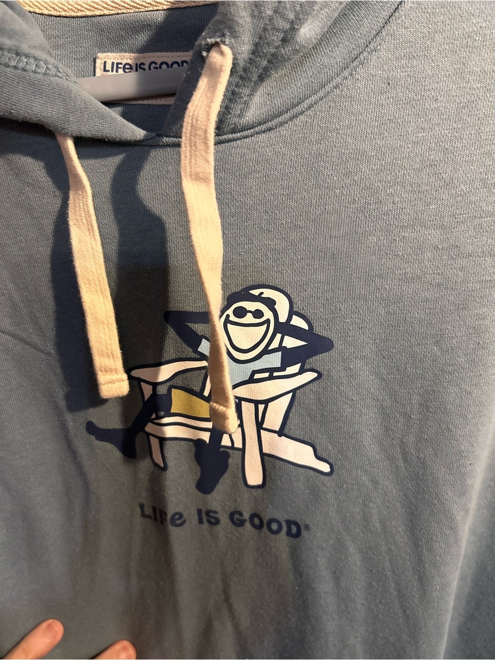 Life Is Good Light Blue Hoodie with Beige Drawstrings and Graphic